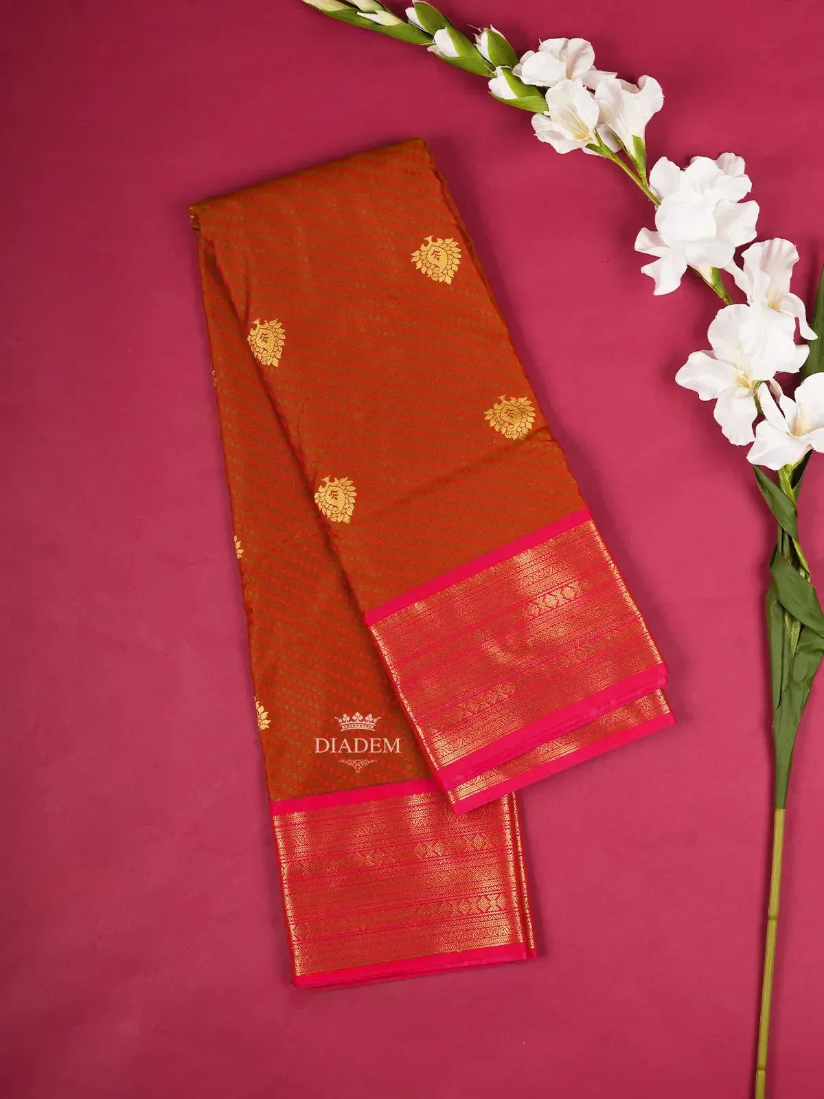 Brown Art Silk Saree with Paisley and Floral Design on the Body with contrast Designed Border